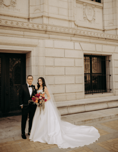 Groom wearing a custom wedding tuxedo from Tailored Gents at Savile Row with his bride.